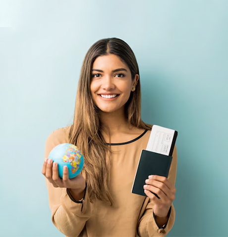 Smiling woman holding globe and passport for study abroad consultants in kochi